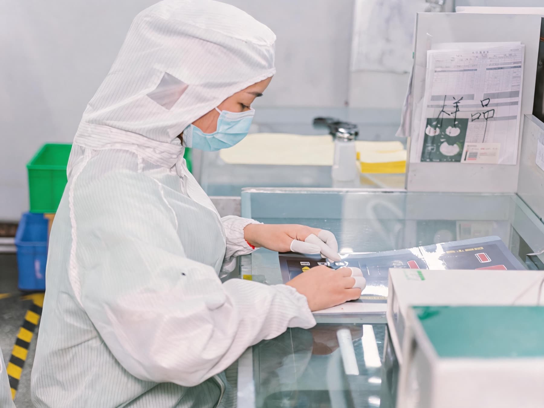 Quality inspector checking a printed membrane panel